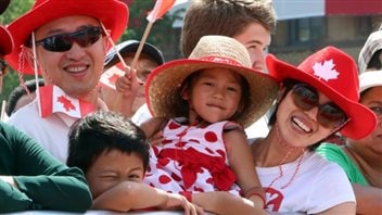 As the CBC website says “Ron Liu, along with son Robbie, 6, daughter Elaine, 4, and his wife, May, take part in Canada Day celebrations on Parliament Hill in 2014. CBC is getting ready to celebrate Canada's 148th birthday in 2015 with coverage of the huge party on July 1.” 