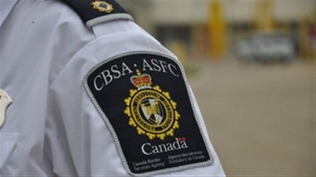 The Canadian Border Services Agency says four charges have been laid against Elizabeth "Lisa" Large in relation to a number of cases of women claiming to be tourists, while attempting to enter Canada to work as nannies. 