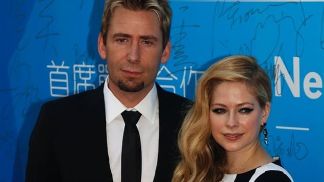 Avril Lavigne and husband Chad Kroeger, lead singer of Nickleback, also dealing with health issues, photographed in October 2013, at the Huading Awards in Macau, China