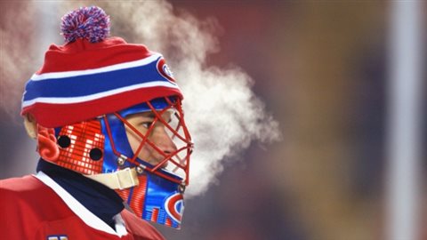 Combining two great Canadian traditions, hockey, and a toque...actually three, playing hockey outdoors. Nov 2003, former Montreal Canadiens goalie Jose Theodore wears a Canadiens toque over his helmet at the Heritage Classic (outdoor) game against the Edmonton Oilers. 