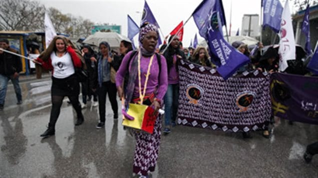 An African woman marches for food scvereignty at the World Social Forum in Tunis in March 2015