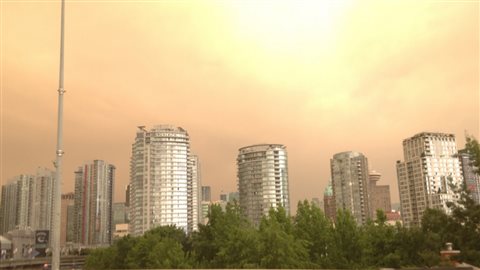 Even a bright sun barely penetrates the smokey haze over Vancouver