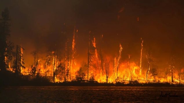 The Egg fire sears a peninsula jutting into Lac La Ronge on Friday in central Saskatchewan