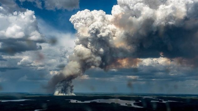 A massive plume of smoke rises from a wildfire in the LaRonge, Sask., area on Wednesday. There are 114 fires burning in northern Saskatchewan as of midday Saturday.