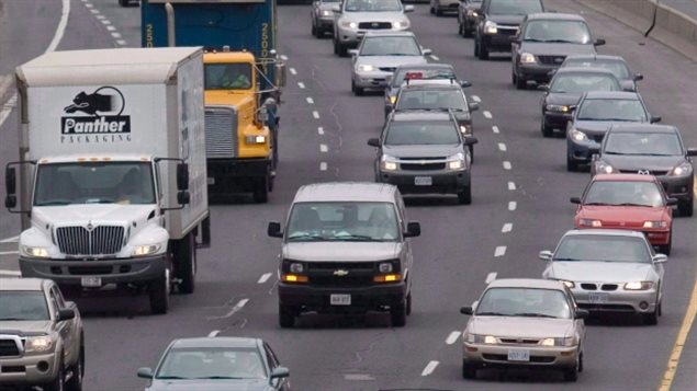 Paint has started to come off the white diamond patterns marking temporary lanes for the Pan Am Games in Toronto, so imagine this traffic restricted to the two left lanes!