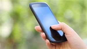 Is this any way to register to vote? it will be say the creators of the Vote Note App. We see a smart phone being held in someone's right hand. The person's thumb is on the screen.