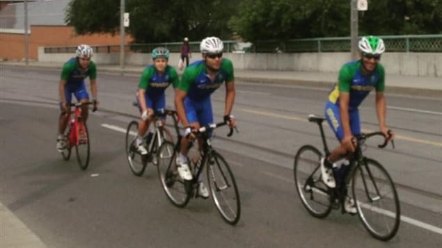 A witness says the cyclists, seen here on Queen Street East just east of River Street, had police in front and behind them as they were escorted off the DVP