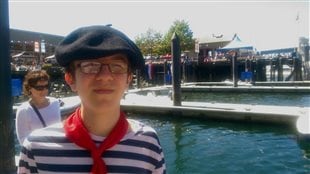 A young man decked-out to celebrate the first Bastille Day celebration on Granville Island in Vancouver yesterday