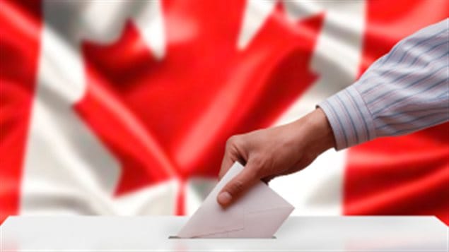 It appears over a million Canadians will not get to vote in the next federal election. We see a hand reaching from the right side of the picture. It is holding a ballot and about to enter it into a ballot box. In the background we see the Canadian flag