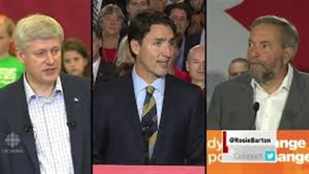 Conservative leader Stephen Harper, left, is a veteran of leadership debates. Liberal leader Justin Trudeau, centre, and NDP leader Tom Mulcair, right, are making their debate debuts. We see a combined photo (from separate events) of the leaders. Mr. Harper is wearing a dark suit jacket and no tie. Mr. Trudeau wears a fancy dark suit and tie. Mr. Mulcair is also without a tie and is wearing a grey sports coat. 
