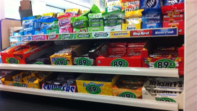 Walls of junk food are what shoppers face when they wait in line to pay for their groceries.