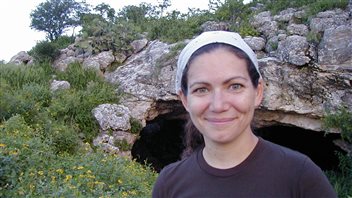Most of the bats in this study came from the cave seen behind biologist Noa Davidai.