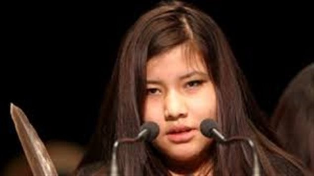  Rinelle Harper addressed the Assembly of First Nations last December, just weeks after she survived an attack near downtown Winnipeg. We see a 16-year-old girl with dark brown standing behind microphones. Her eyes are puffy and she appears just a bit lost.
