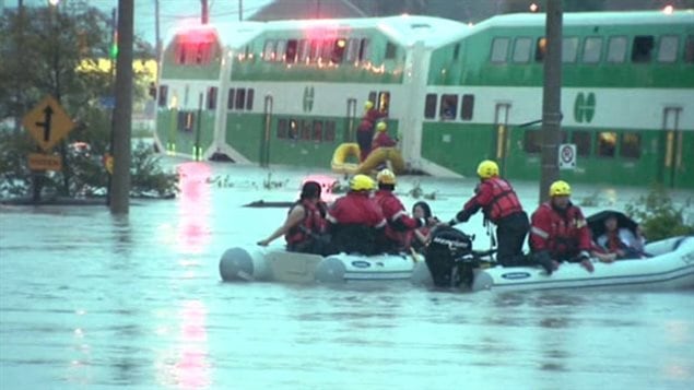 Passengers from a commuter train in Toronto had to be rescued as an abnormal amount of rain fell suddenly on Canada's biggest city. City cewers were unable to cope with the amount resulting in major flooding of streets, highways and the dity subway system.