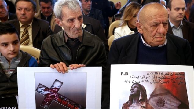 February 2015 : Assyrian citizens hold placards during a sit-in for abducted Christians in Syria and Iraq. ISIS militants snatched hostages from homes in northeastern Syria, bringing the total number of Christians abducted to overand estimated 300 to that date.