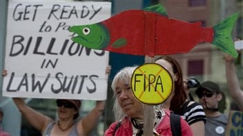 Citizens protest the Canada-China Foreign Investment Promotions and Protection Agreement in the western city of Vancouver on June 5, 2013.