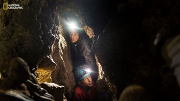 Researchers had to squeeze through narrow chutes leading to the cave containing the bones of the new species.