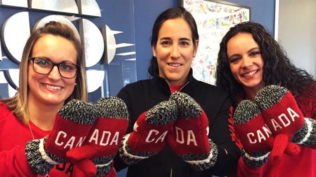 Olympic gold medallists Marie-Philip Poulin, Caroline Ouellette and Shannon Szabados (left to right) show off the new version of Canada’s Olympic mittens.