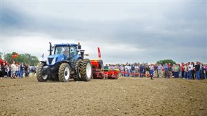 Interested crowds gather to watch a demostration of new seeding quipment and technology at the Outdoor Farm Show in Woodstock Ontario