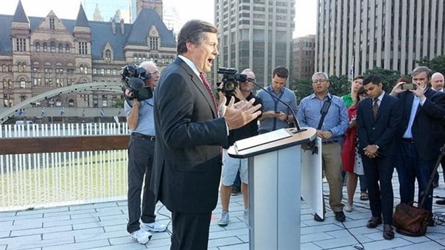 Mayor John Tory speaks to reporters in front of City Hall explaining why Toronto will not be a contender for the 2024 Summer Olympics