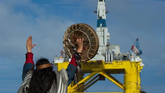 June 17,2015 Audrey Siegl, a Musqueam woman from British Columbia, Canada, who is also a renowned public speaker, drummer and singer, stands in a Greenpeace rhib launched from the MY Esperanza holding her arm out in front her, defiantly signaling Shell's subcontracted drilling rig, the Polar Pioneer, to stop