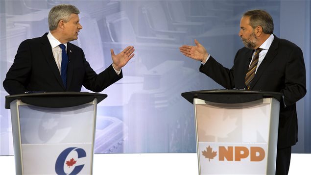 Stephen Harper (izq) y Thomas Mulcair, durante el debate en francés anoche en Radio Canadá. 