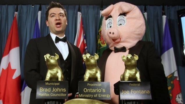 Aaron Wudrick, Federal Director of the Canadian Taxpayers Federation with mascot 