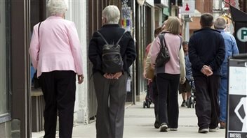 Senior citizens make their way down a street in Peterborough, Ontario in May, 2012.