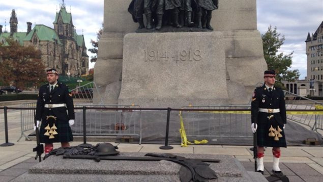 Cpl Nathan Cirrillo (left) anc Cpl Brandon Stevenson right standing guard at the Tomb of the Unknown Soldier in Ottawa minutes before the fatal attack. Twitter user ?@kamakazi19982 posted this photo online with the message 'OK, so we were on a tour at that war monument in Ottawa a few minutes ago, a few seconds later there was a shooting.'