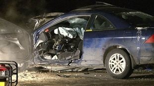The 17-year-old in this accident was texting while driving. He survived, barely. We see the right side a blue sedan, It's is virtually demolished. The hood is pushed to the windshield. The front seat is a complete wreck, though we see seat belts above the mess, seat belts that likely saved his life.