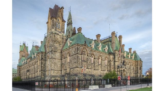 The West Block of Parliament currently undergoing extensive renovation. The southeast tower is shown with its new copper roof and restored cap. (the initially shiny copper turns brown and then green over time with oxydization)