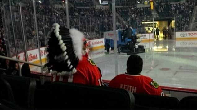 A fan wore an aboriginal headdress at a hockey game last March between the Winnipeg Jets and the Chicago Blackhawks. The Blackhawks’ team logo is the head of an aboriginal man.