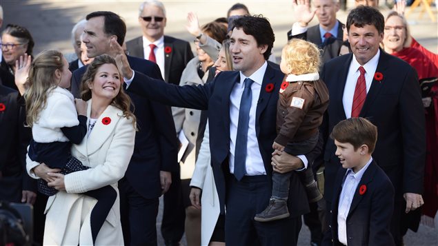  Prime Minister-designate Justin Trudeau holds son Hadrien while his wife Sophie Gregoire-Trudeau holds daughter Ella-Grace and their oldest son Xavier walks alongside as they arrive at Rideau Hall with Trudeau's future cabinet to take part in a swearing-in ceremony in Ottawa on Tuesday, November 4, 2015. 