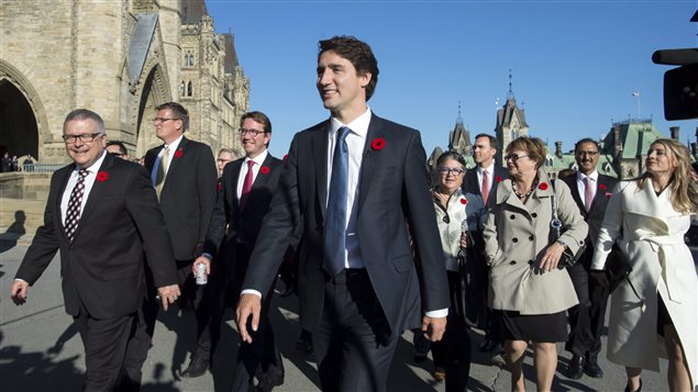  Prime Minister Justin Trudeau arrives on Parliament Hill with his newly sworn in cabinet ministers, in Ottawa on Wednesday, Nov. 4, 2015. 