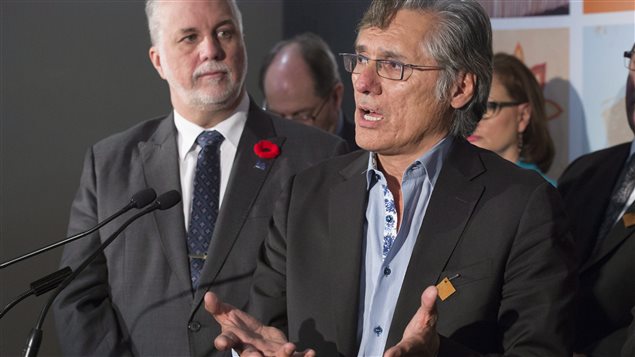 Philippe Couillard, Premier of Quebec, (left) listens to Matthew Coon Come, Grand Chief of Quebec Crees, during a news conference following a meeting with native leaders this morning in Montreal.