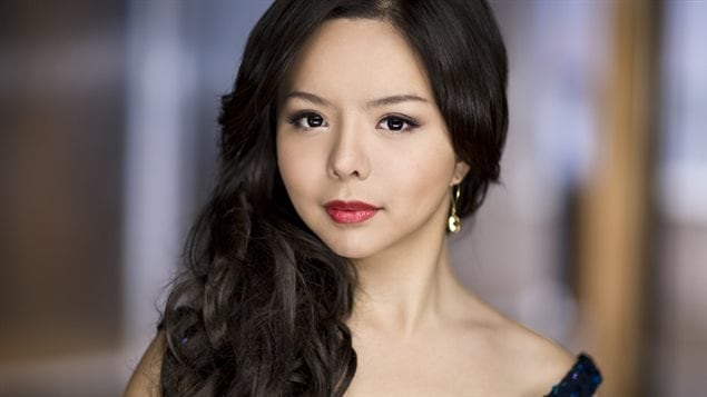 Miss Canada Anastasia Lin says China is delaying her visa for the Miss World pageant because of her outspoken views on human rights.