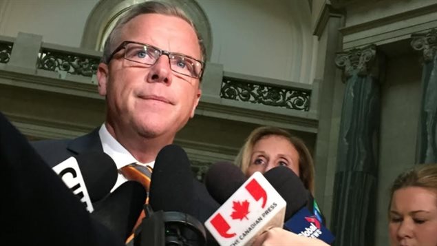 Sask. Premier Brad Wall speaking to reporters about the federal government's plan to bring 25,000 Syrian refugees into the country.  A month ago, the province was in favour, now he wants the programme suspended