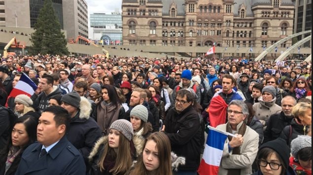 One of many vigials and demonstrations of support for France held across Canada this weekend. Here crowds gather in front of Toronto which was also attended by Mayor John Tory and Marc Trouyet, France's consul-general in Toronto. Many in the crowd joined in the singing of the French national anthem