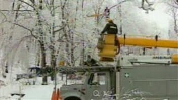Utility crews could not keep up with calls to repair power lines downed and damaged by ice in 1998.