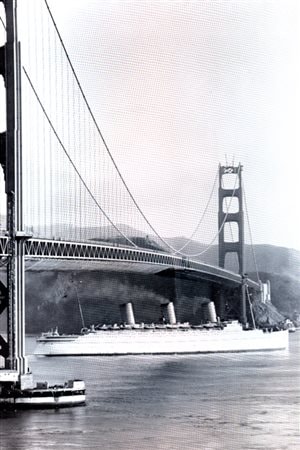 The luxurious CP liner, Empress of Britain, one of many of its substantial fleet of ships and luxury liners. Here it passes under the Golden Gate bridge in San Francisco on its 1931-32 world cruise