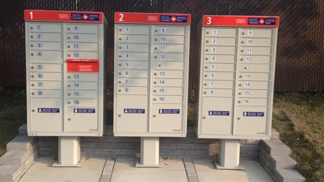 Canada Post community mailboxes, The phase ouf of home delivery was needed says Canata Post, to slow down the red ink. The union says, CP is misleading the public