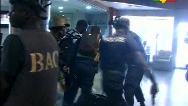  In this TV image taken from Mali TV ORTM, security forces help hostages to safety, inside the Radisson Blu Hotel in Bamako, Mali, Friday Nov. 20, 2015. 