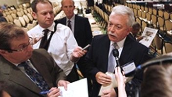 Ron Stotish of AquaBounty speaks to reporters at an FDA hearing in Rockville Maryland on September 20,1010, Late last week the FDA approved the salmon product, becoming the world's first GM food animal approved for human consumption