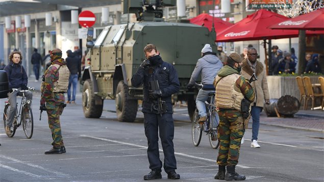  Belgian soldiers and police patrol in central Brussels as police searched the area during a continued high level of security following the recent deadly Paris attacks, Belgium, November 23, 2015.