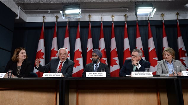  Jane Philpott, (left to right) Minister of Health, John McCallum, Minister of Immigration, Refugees and Citizenship, Harjit Sajjan, Minister of National Defence, Ralph Goodale, Minister of Public Safety and Emergency Preparedness, and Mélanie Joly, Minister of Canadian Heritage announce Canada's plan to resettle 25,000 Syrian refugees, during a press conference at the National Press Theatre in Ottawa on Tuesday, Nov. 24, 2015. 