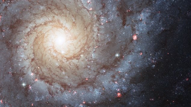 This Hubble Space Telescope photo of Messier 74 reminds us that spiral galaxies are some of the most beautiful and photogenic residents of the universe. Nearly 70 percent of the galaxies closest to the Milky Way are spirals. New research finds that spiral arms are self-perpetuating, persistent, and surprisingly long lived. Image released April 2, 2013.