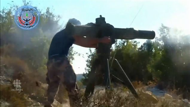 A Turkmen fighter fires an anti-tank missile at a Russian search and rescue helicopter in Syria.