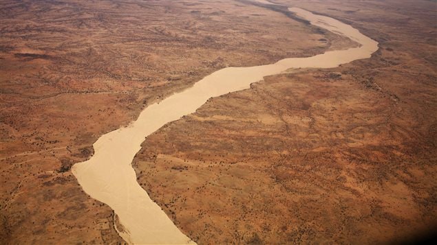  A dried up river filled with sand winds its way across the desert near Gos Beida in eastern Chad June 5, 2008.