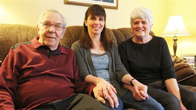 Janice Martell with her father, now suffering from Parkinson's, and her mother Elaine Hobbs. Workman's compensation would help to cope with the affliction but government agencies reject the claim of damage from aluminium.