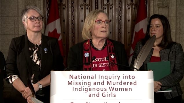 Indigenous and Northern Affairs Minister Carolyn Bennett (C) announced the first steps for her government's promised inquiry into missing and murdered indigenous women Tuesday afternoon in Ottawa. 